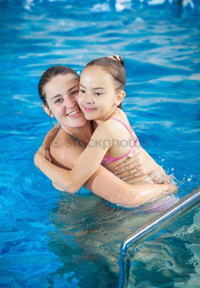 Similar – two little girls playing in the pool at the day time