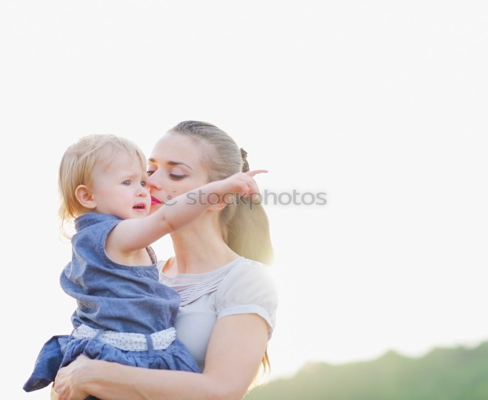 Similar – happy young mother and her baby boy lying on bed and smiling