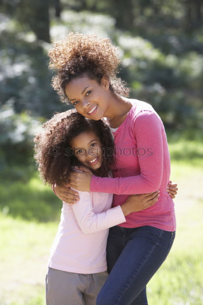 Similar – Kissing mother and daughter in summer