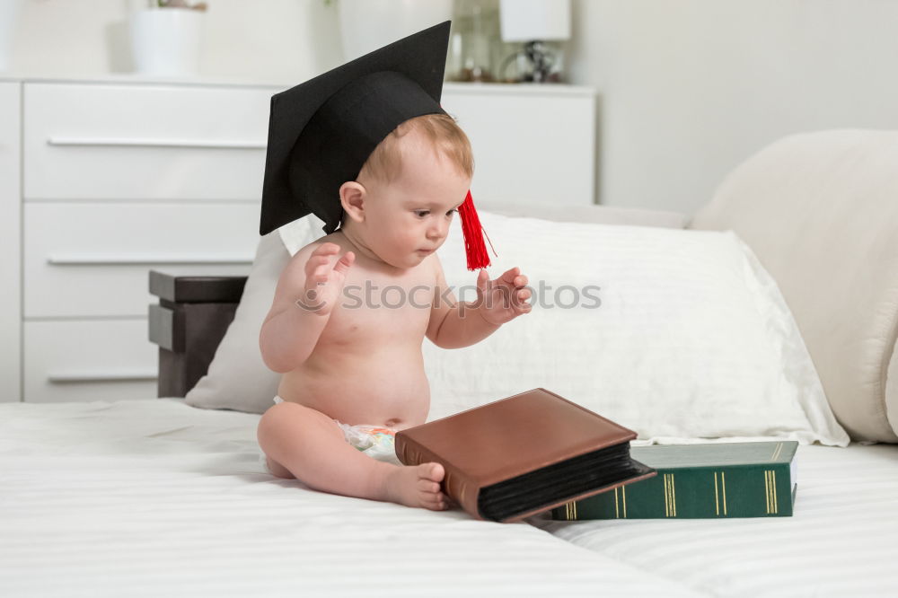 Similar – Image, Stock Photo Little boy sitting on the bed and smile