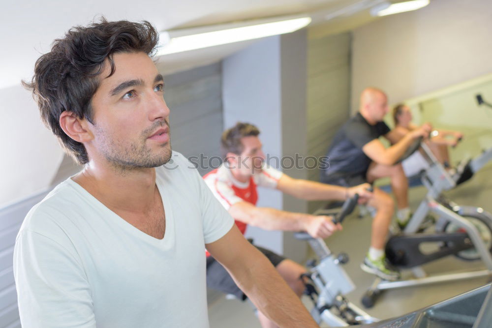 Similar – Image, Stock Photo Couple in a spinning class wearing sportswear.