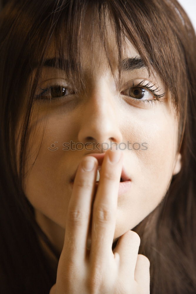 Similar – Young woman winking an eye with a bow tie in her mouth