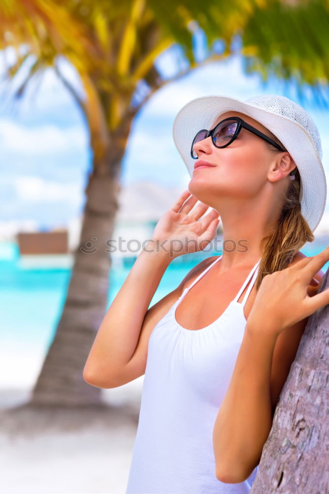 Similar – Woman in bikini sitting on bench near water