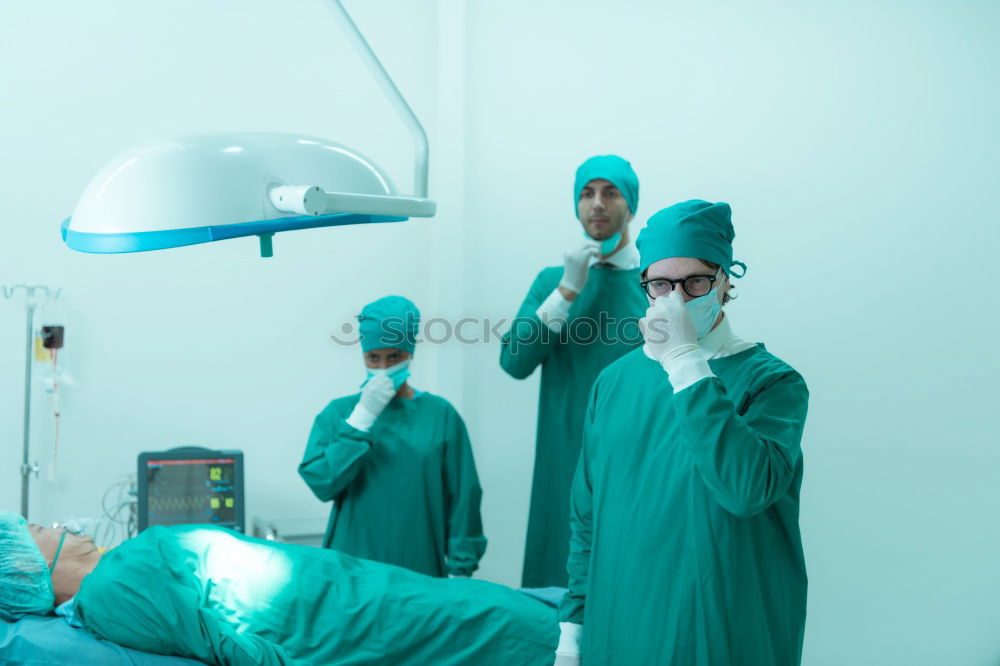 Similar – Image, Stock Photo Team of Surgeons Operating.