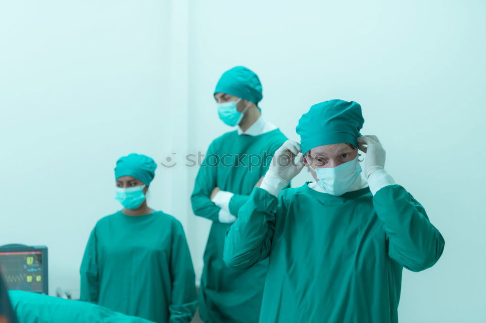 Image, Stock Photo Team of Surgeons Operating.