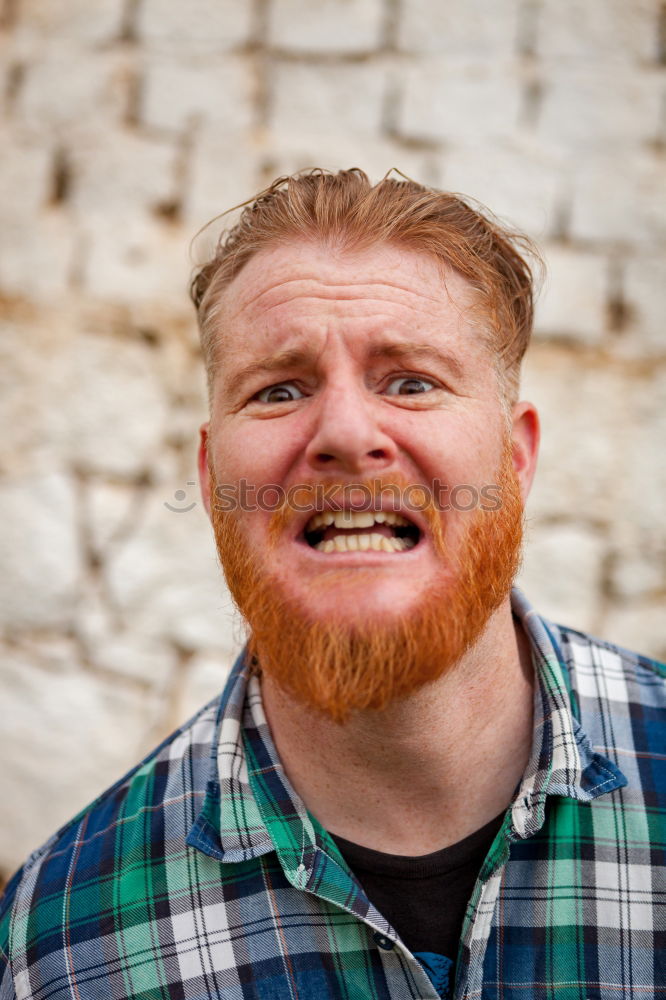 Similar – Portrait of a hipster guy putting silly face