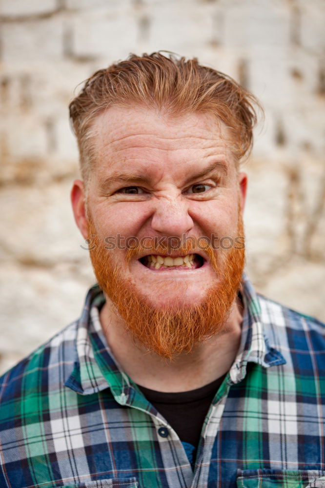 Similar – Portrait of a hipster guy putting silly face