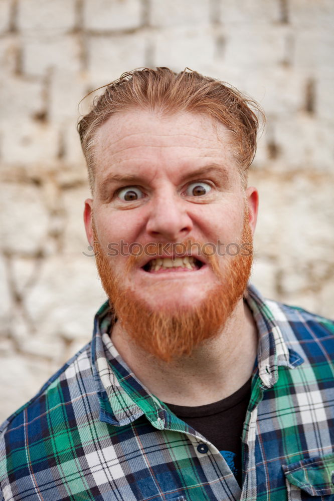 Similar – Portrait of a hipster guy putting silly face