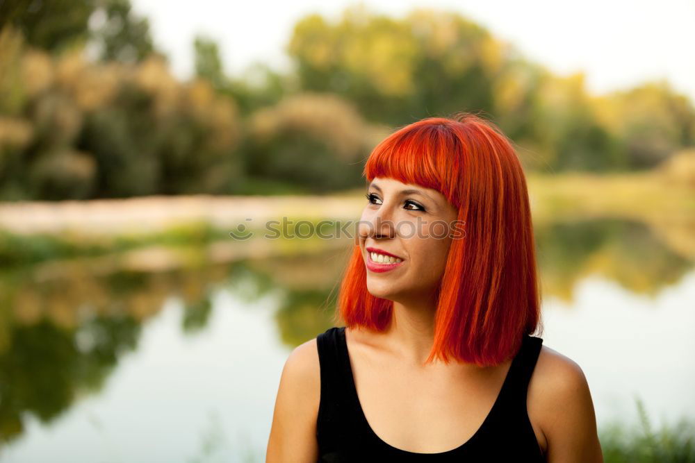 Similar – Happy red hair woman in a park