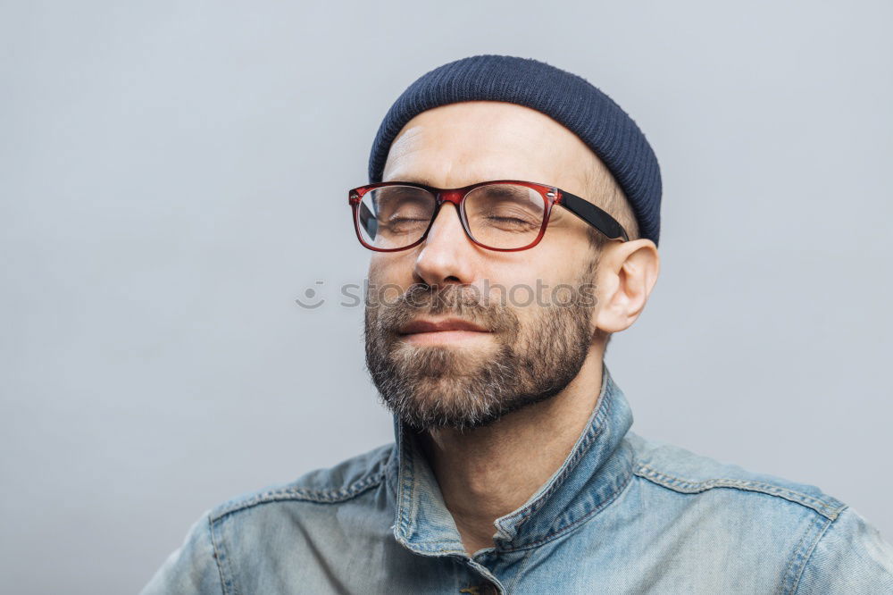 Similar – Man with mustache and glasses standing with crossed arms.