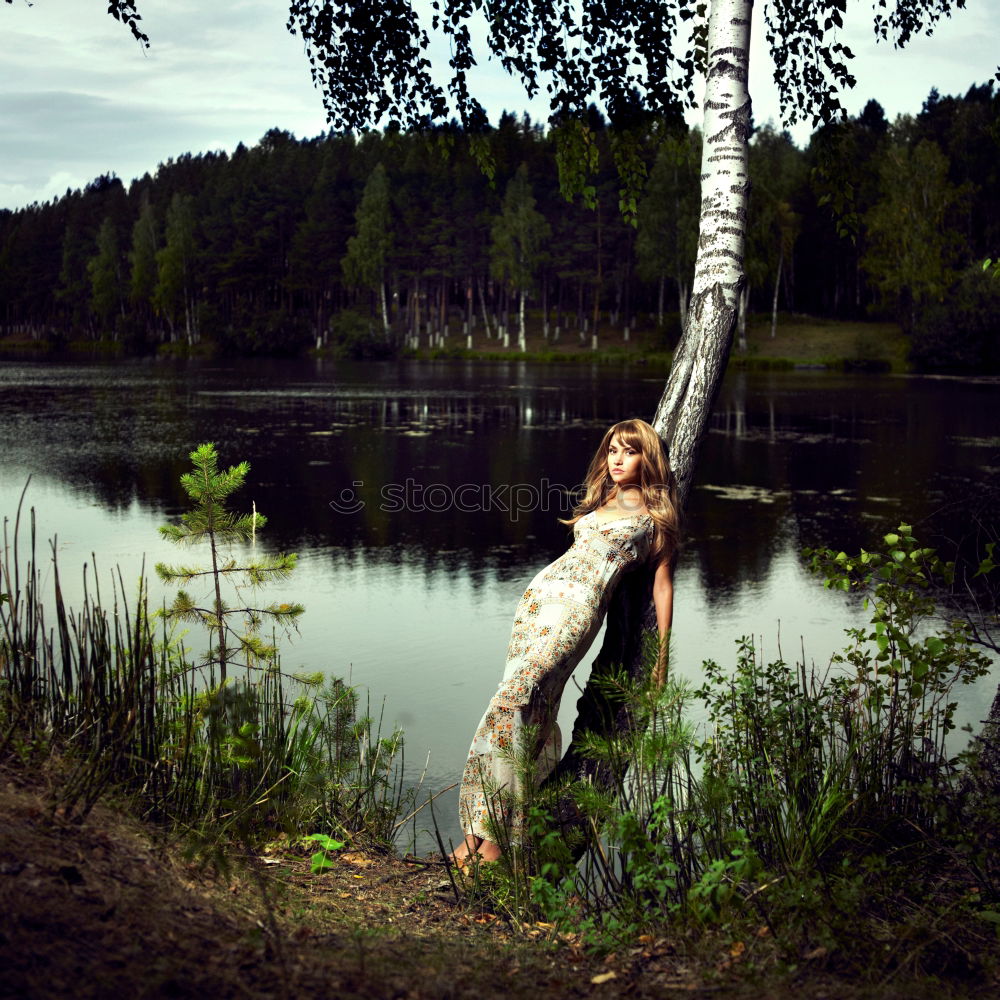 Similar – Image, Stock Photo Boy sitting on air-filled plastic crocodile in a lake