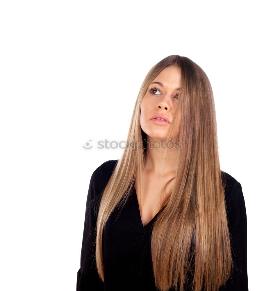 Similar – young woman looks up at the text space