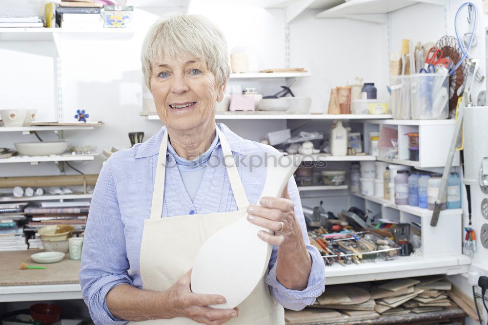 Similar – Senior woman sewing protective masks at home