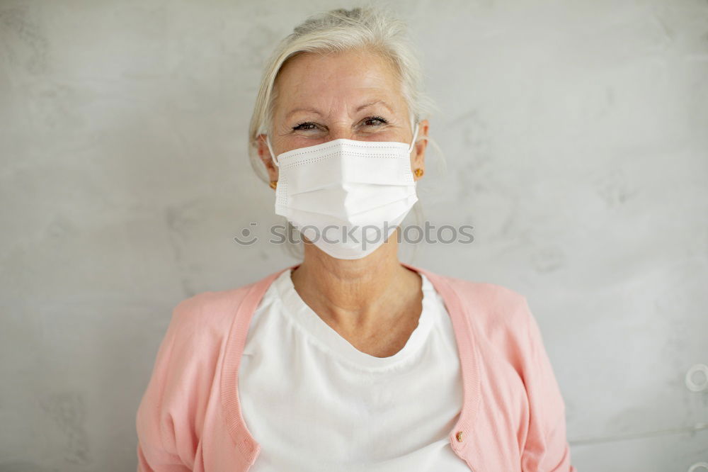 Similar – Brunette woman wearing a mask