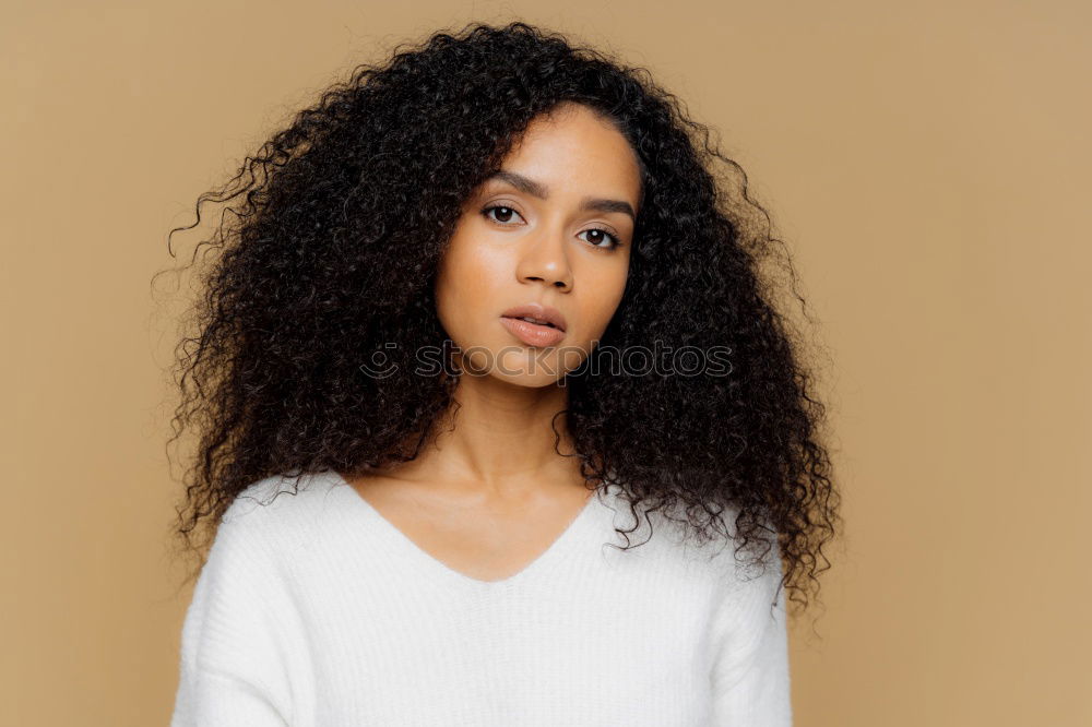 Similar – Image, Stock Photo Mixed woman with afro hairstyle standing in an urban park