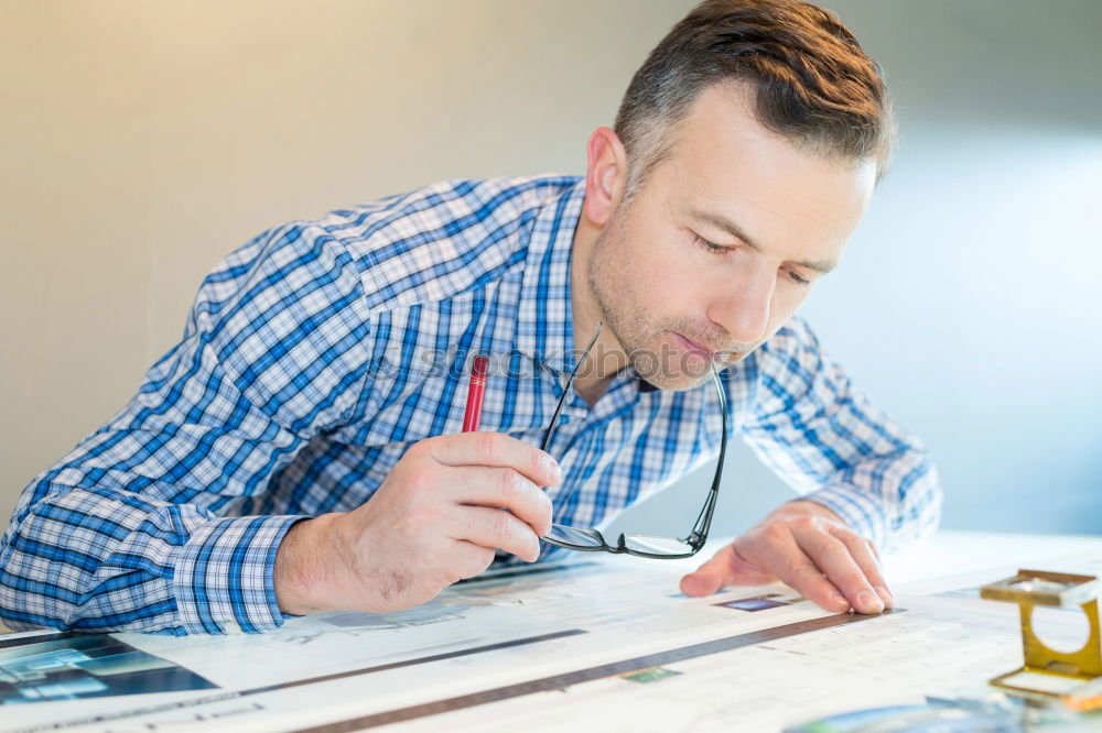 Similar – Image, Stock Photo Architect or planner working on drawings for construction