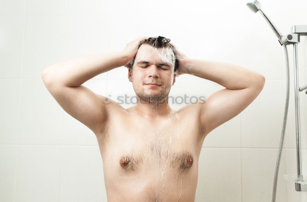 Similar – Friendly young man soaping himself in the shower