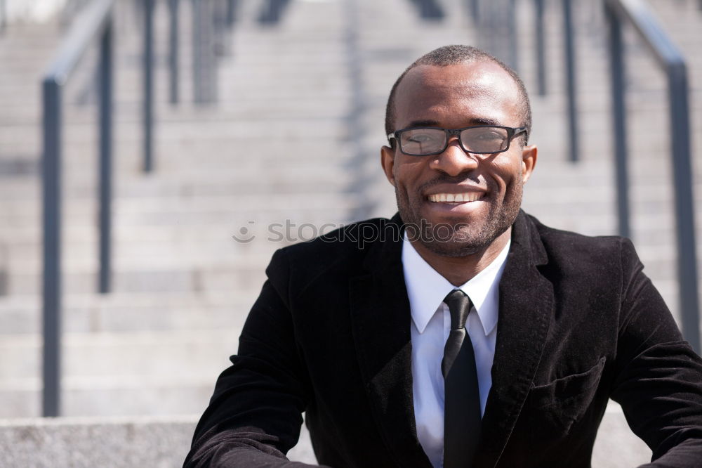 Similar – Handsome black man wearing suit in urban background