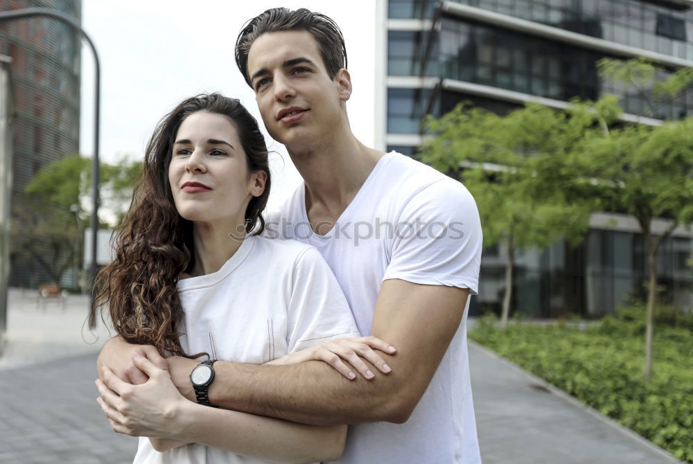 Similar – Image, Stock Photo Beautiful young couple hugging, looking at camera and smiling