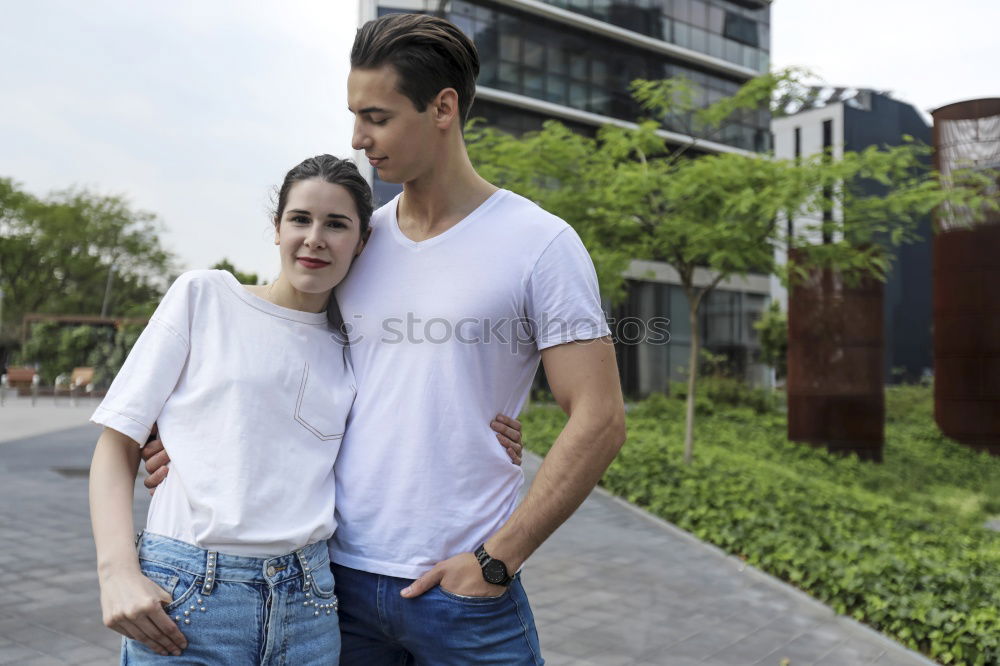 Similar – Young beautiful couple posing wearing jeans and t-shirt