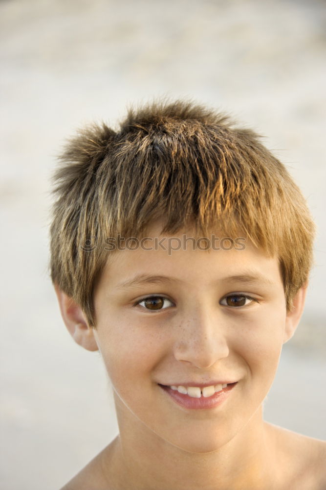 Similar – Portrait of a cute kid with hat in front of a ocean