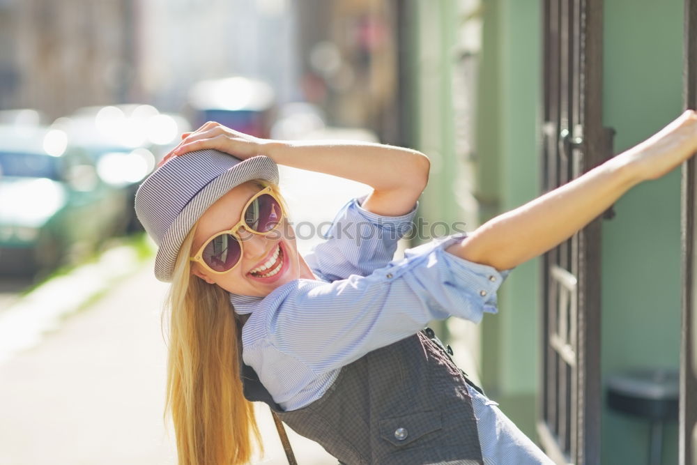 Similar – Image, Stock Photo Cheerful stylish woman in hat