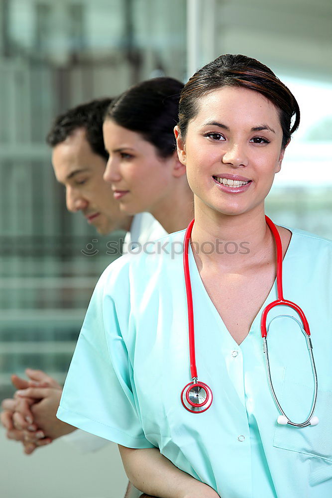 Similar – Smiling Female Doctor With Face Mask Wearing Scrubs In Busy Hospital During Health Pandemic