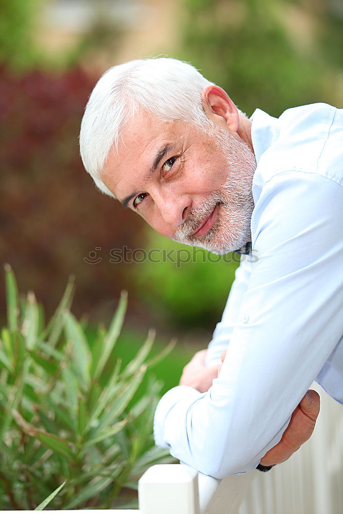 Similar – Portrait of a mature man sitting on steps in the street