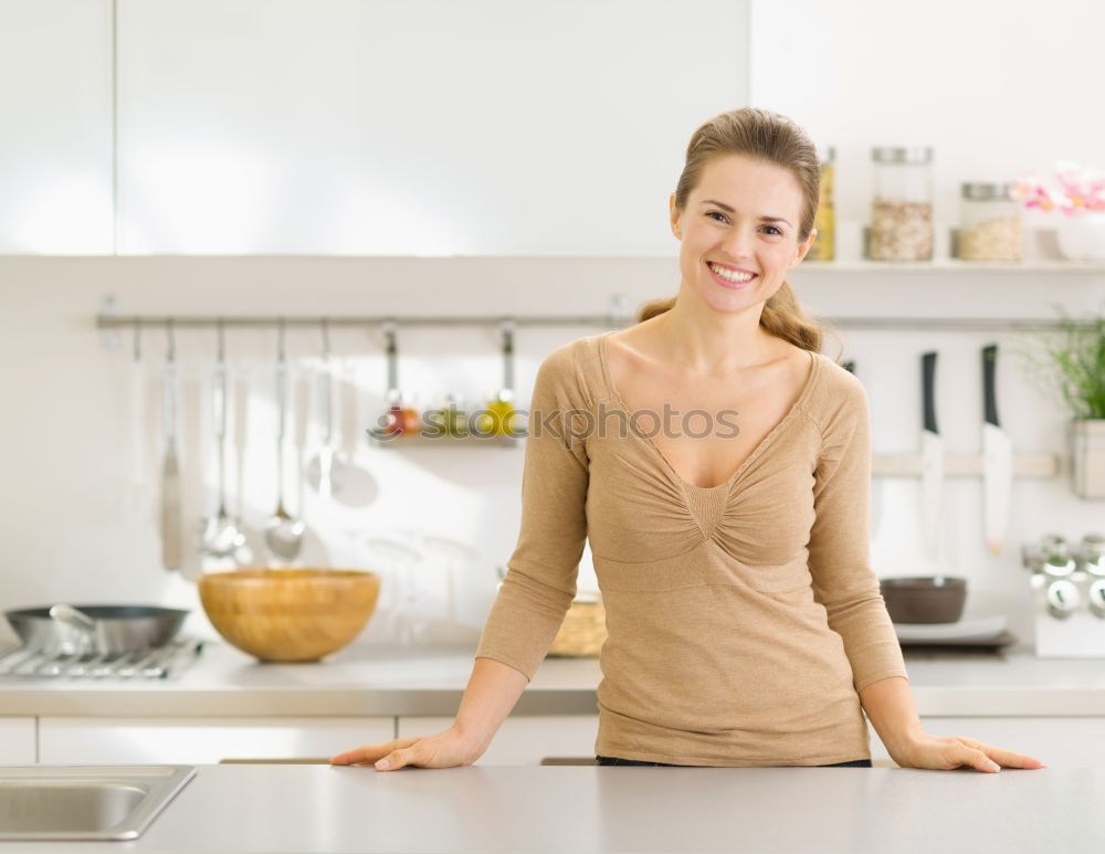 Similar – Image, Stock Photo Happy contented housewife in her kitchen