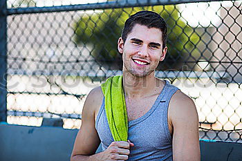 Similar – Image, Stock Photo Young man in sportswear leaning on metal fence and posing on sta