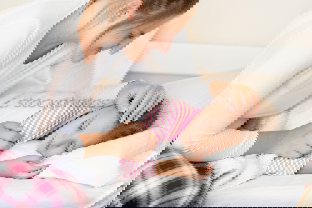 Similar – Image, Stock Photo mother kisses her toddler son in bed for good night