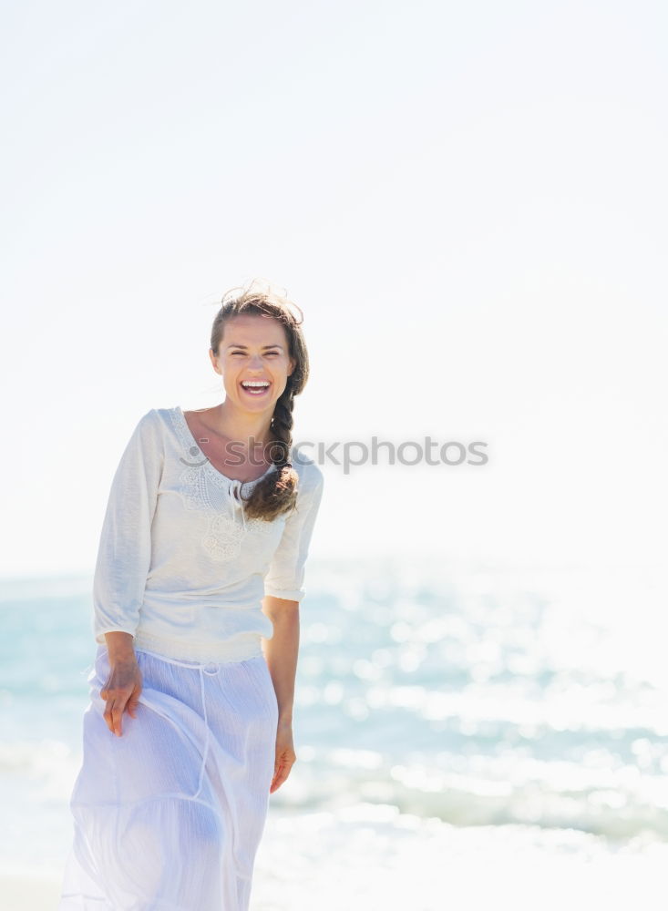 Similar – Image, Stock Photo Woman walking away on the idylic beach.