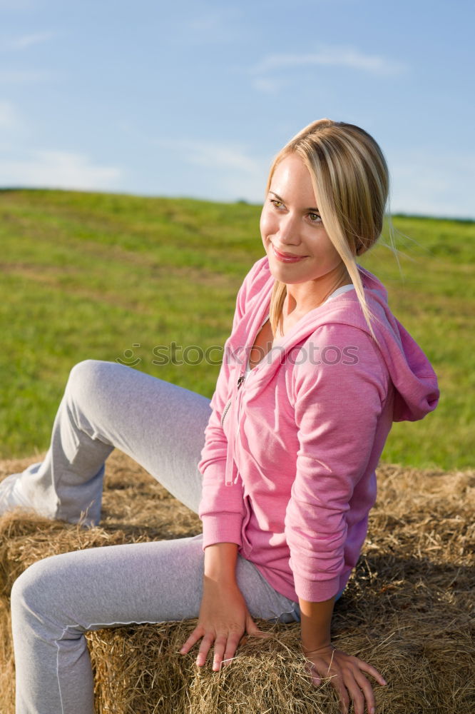 Image, Stock Photo blonde woman sitting in the grass and stretching in a park