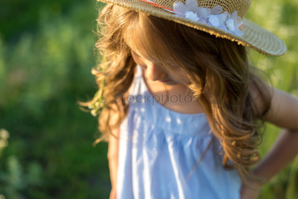 Similar – child girl in country style plaid shirt and hat