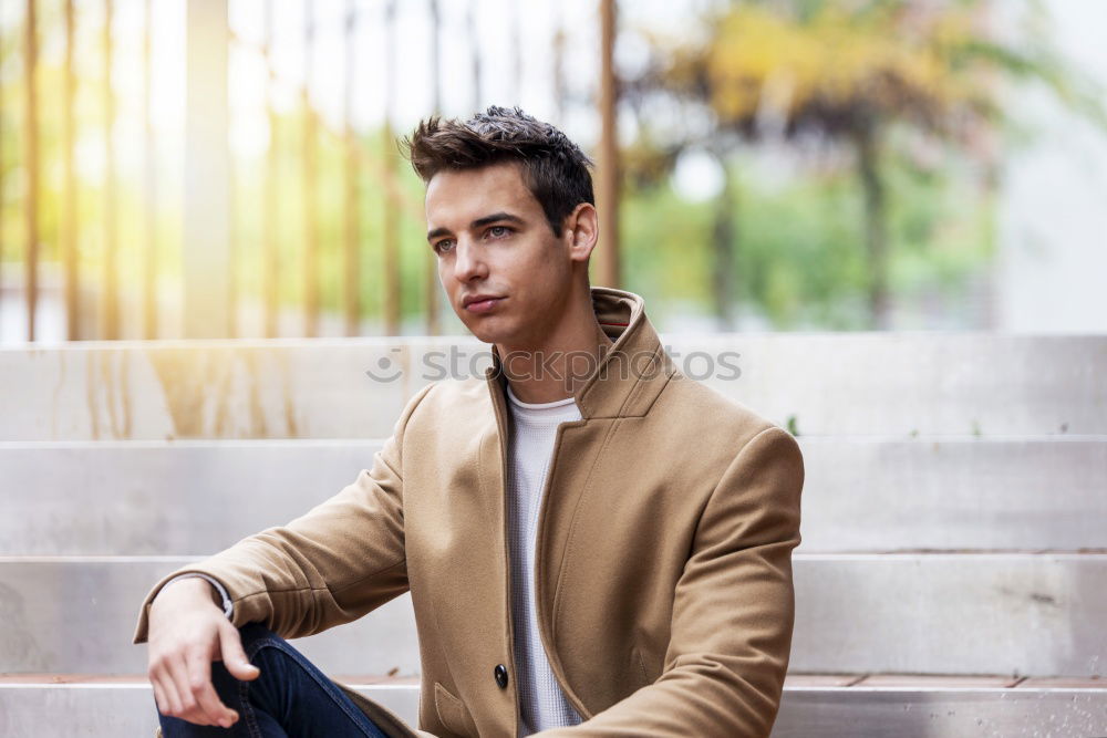 Similar – Image, Stock Photo Young man wearing winter clothes in the street sitting