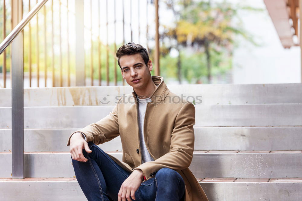 Similar – Young smiling man wearing demi-season clothes in the street