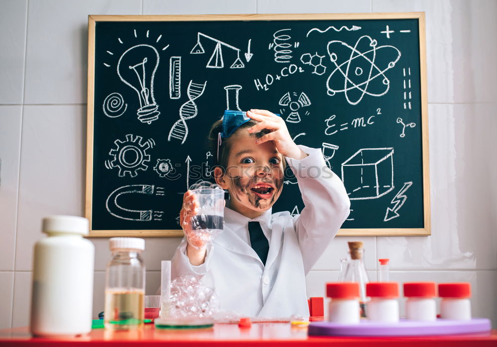 Similar – Image, Stock Photo Boy dressed as chemist with dirty face after doing an experiment