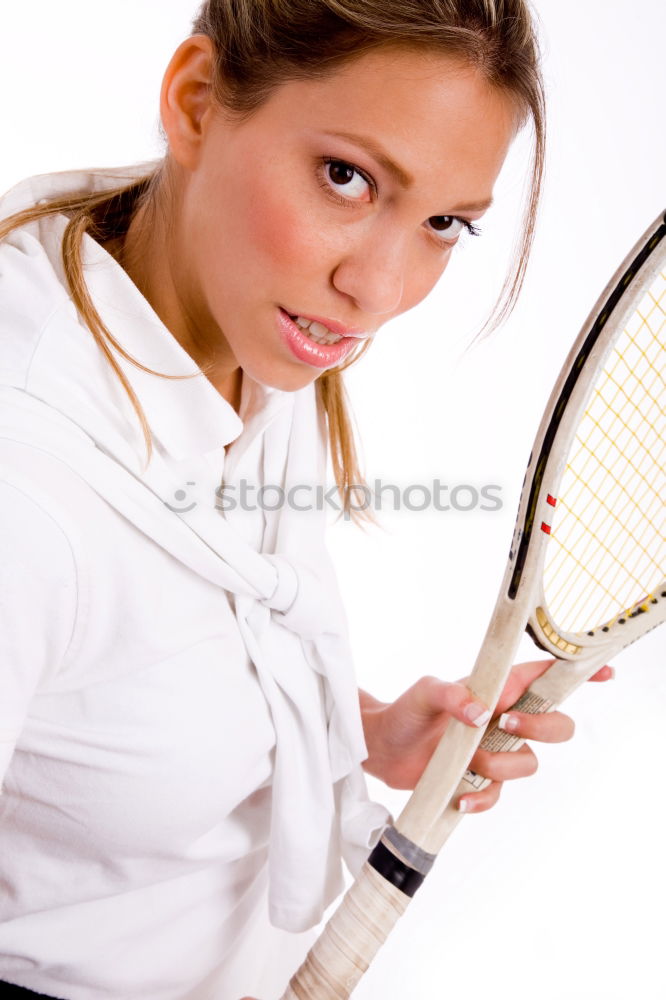 Similar – Face of a young woman hiding behind a featherball bat. Repeating the colour red. Sports grouch. Unsportsmanlike. Defense