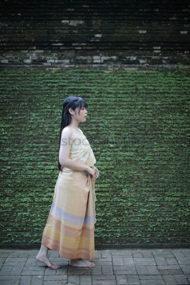 Similar – Pretty Asian woman sitting at pond