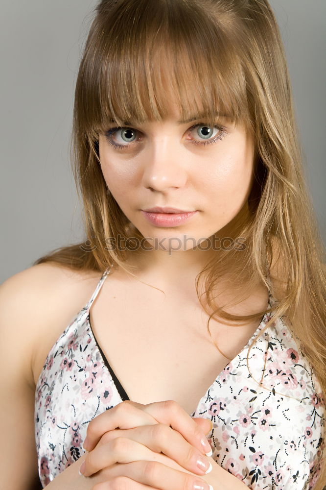 Similar – A young girl sits thoughtfully in a pink shopping trolley amidst pink goods