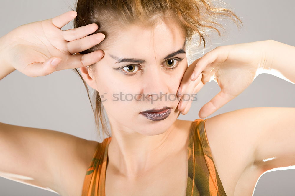 Similar – Close-up of the face of a brunette girl with short hair