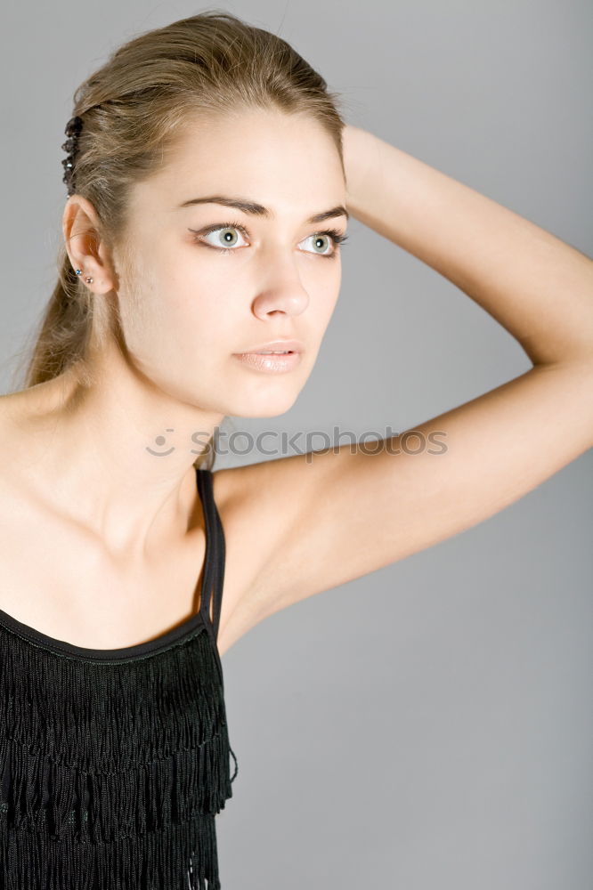 Similar – Girl with blonde hair posing in front of turquoise background