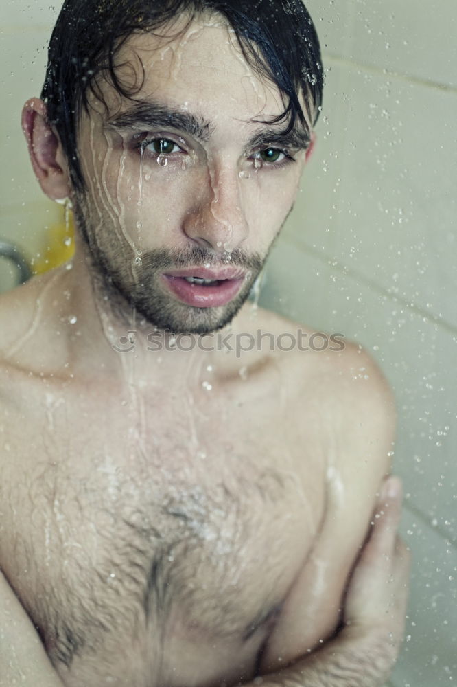 Similar – Young bearded man washing his hair