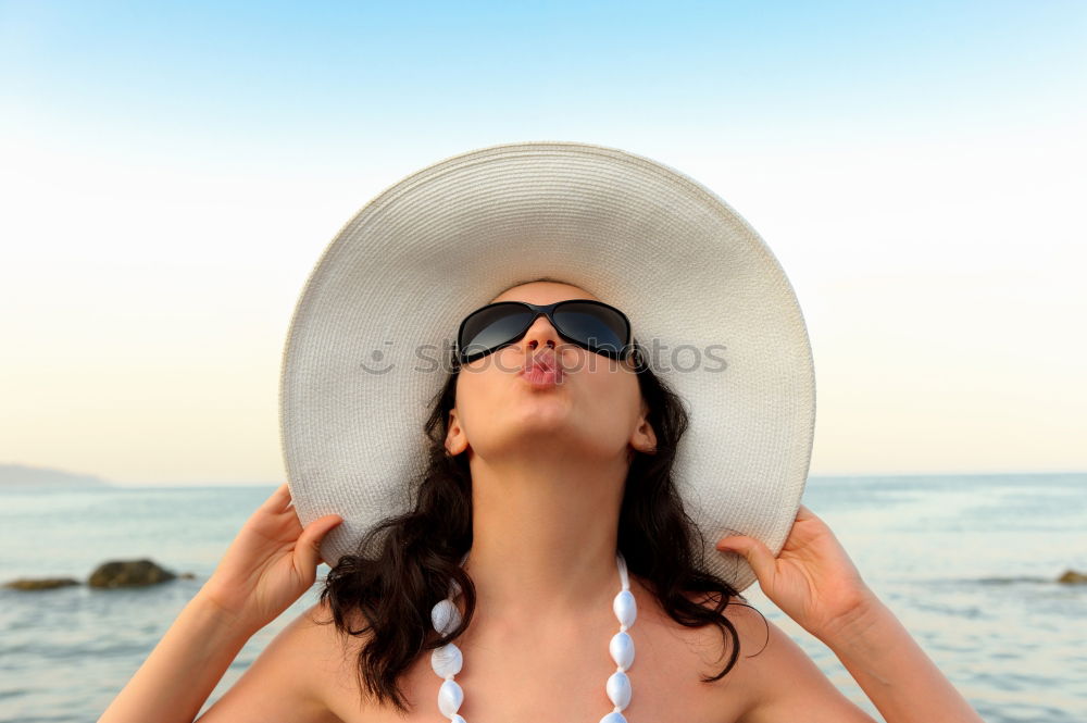 Similar – Young Woman Portrait With White Beach Hat