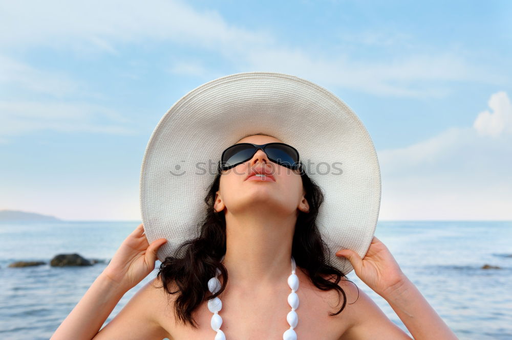 Similar – Young Woman Portrait With White Beach Hat