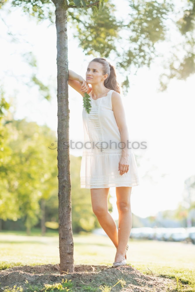 Similar – Image, Stock Photo Content woman standing on autumnal alley