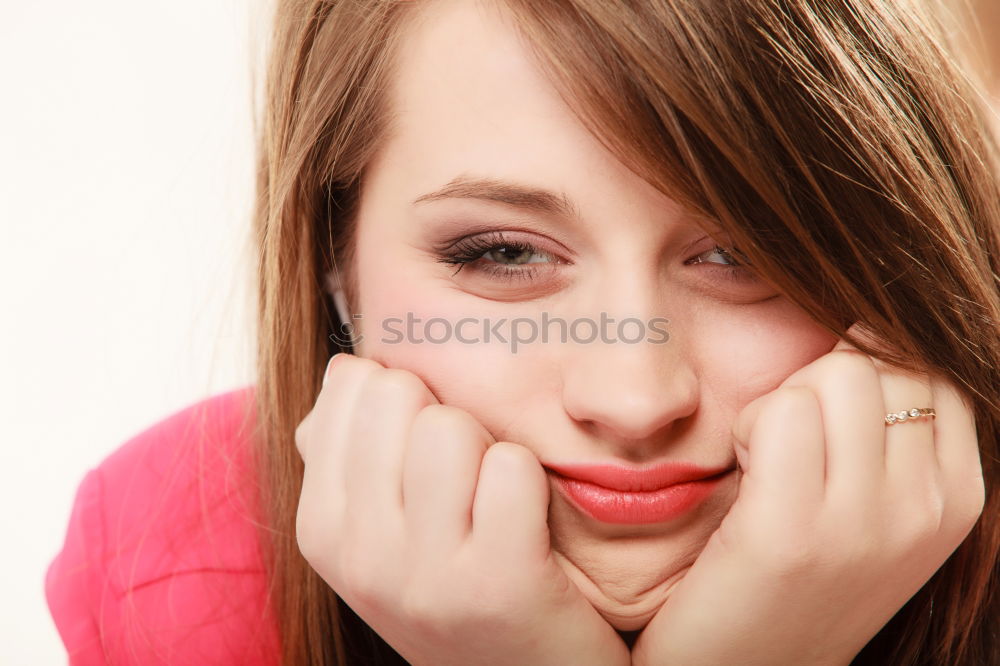 Similar – A young girl sits thoughtfully in a pink shopping trolley amidst pink goods