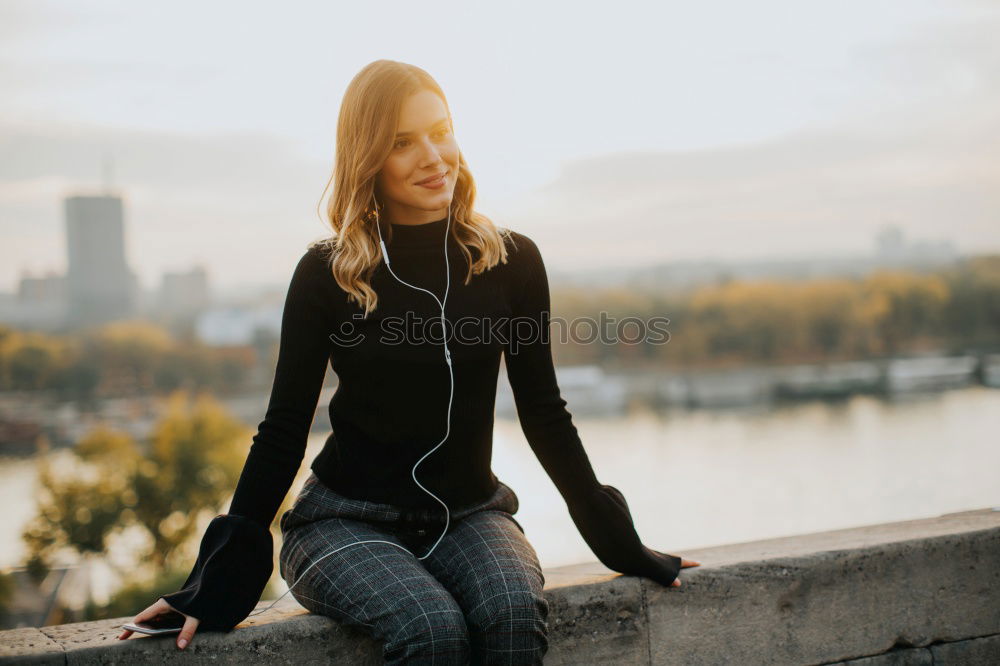 Girl sitting in autumn forest