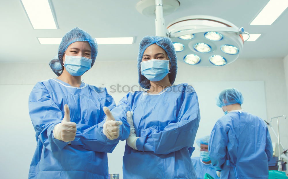 Similar – Image, Stock Photo Team of Surgeons Operating.