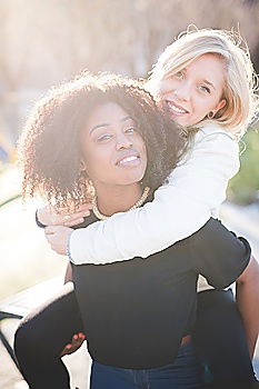 Similar – Image, Stock Photo Cheerful women posing at fence